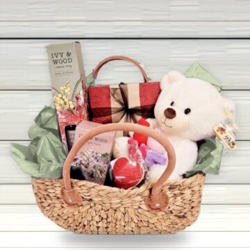 Koala Cuddle teddy gift hamper with teddy, chocolates, cookie and candle in a harvest basket