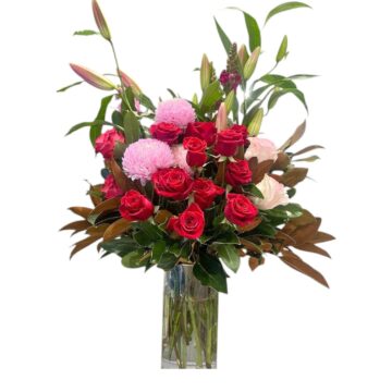 Flame Robin roses & lilies in a vase by Stalks N Stems, Rowville florist